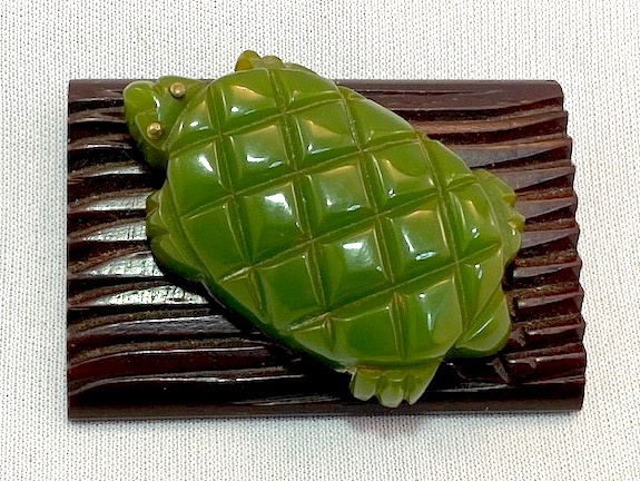 BP273 green bakelite turtle on wood log pin